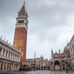 A serene view of St. Mark's Square in Venice featuring the iconic Campanile and Basilica.